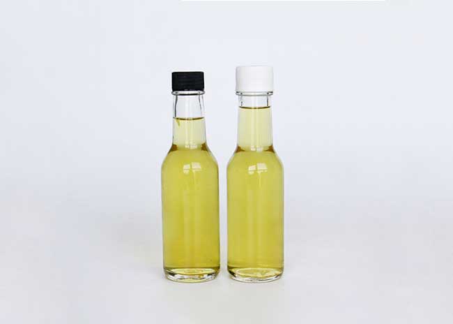Clear glass woozy bottles wholesale with shrink capsules bulk