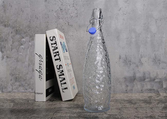 Supplier direct embossed clear 1000ml glass flip top bottle with factory price
