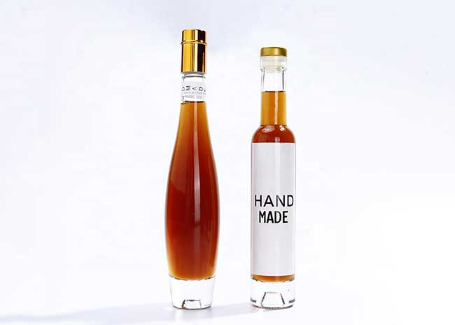 Bulk china suppliers corked empty transparent small glass wine bottles for sale