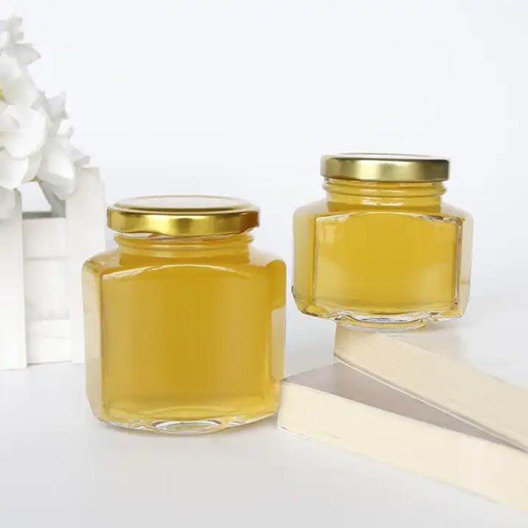 Wholesale clear 100ml glass hexagon honey jars with gold lids bulk