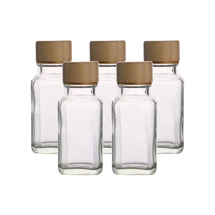 Refillable empty clear small 2oz glass seasoning jars with wood lids wholesale