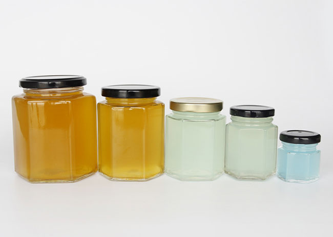 Free sample clear 400ml hexagon glass jars with lids for honey