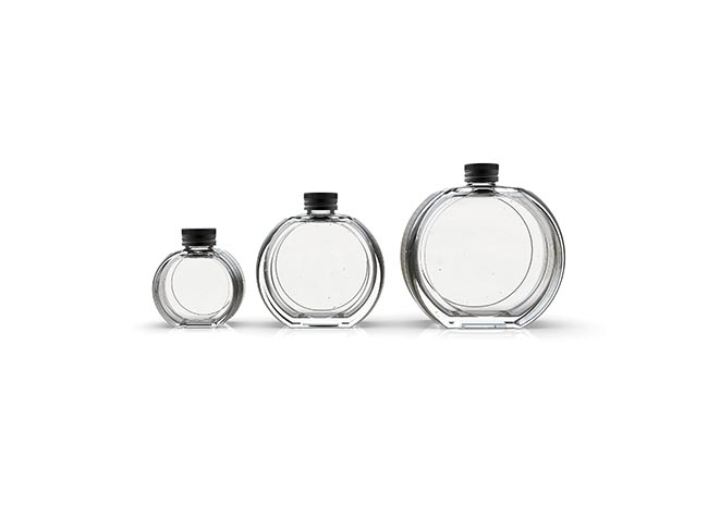 Flat round unique glass bottles with screw top caps