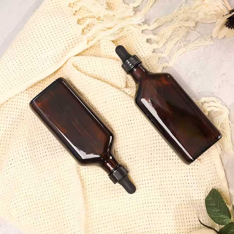 Wholesale 100ml amber glass oblong flasks with bulb dropper for personal care