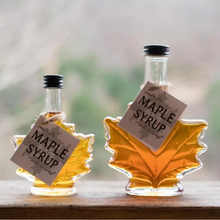 Wholesale empty 50ml 100ml glass maple leaf syrup bottle with aluminum screw lid for pure syrup honey packing