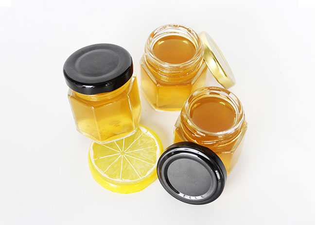 Hexagon Shape custom printing hexagon glass jars wholesale with tin lids for honey/candy